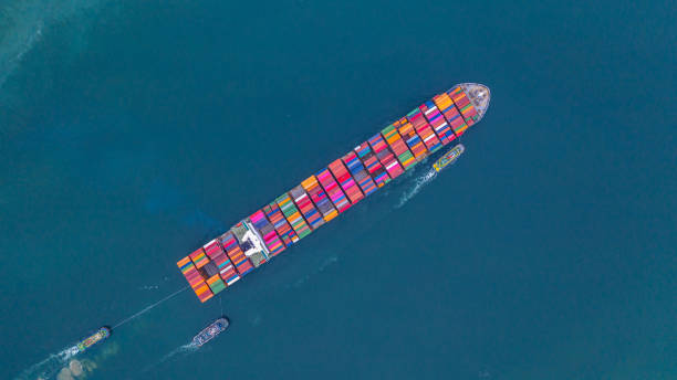 istock Container ship carrying container aerial view, Business import and export logistic and transportation of international by container ship in the open sea, with copy space. 1164340776