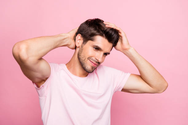 Close-up portrait of his he nice attractive handsome lovely well-groomed virile muscular cheerful cheery content guy touching soft hair keratin repair isolated over pink background Close-up portrait of his he nice attractive handsome lovely well-groomed virile, muscular cheerful cheery content guy touching soft hair keratin repair isolated over pink background dandruff men stock pictures, royalty-free photos & images