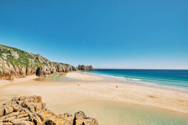 istock Views over Pedn Vounder Beach, Cornwall at low tide on a hot sunny June afternoon. 1164341108