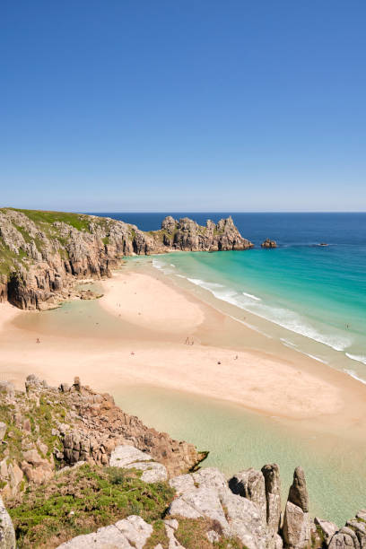 istock Views over Pedn Vounder Beach, Cornwall at low tide on a hot sunny June afternoon. 1164341124