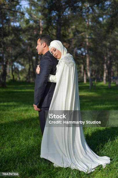 Portrait Of Muslim Bride And Groom Couple Posing In A Public Park Stock Photo - Download Image Now