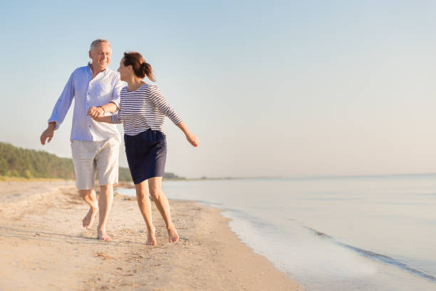 istock Happy senior couple at beach 1164342752