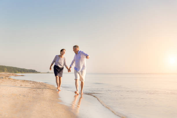 istock Happy senior couple at beach 1164342756