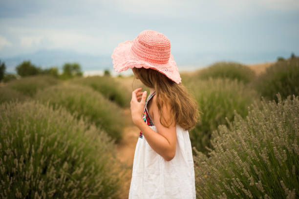 istock lavender field and a young girl 1164344287