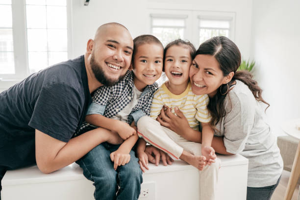 istock Smiling kids with happy parents 1164344857