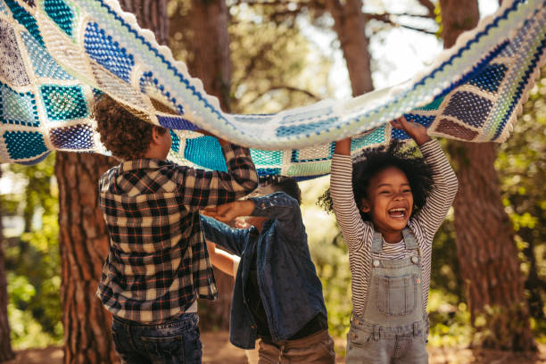 istock Group of children enjoying together in park 1164344973