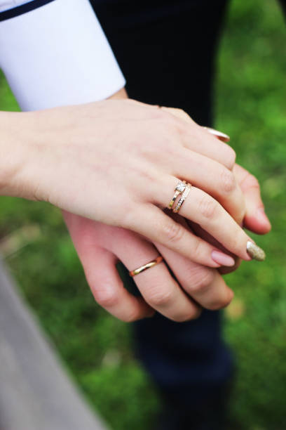 istock Young married couple holding hands 1164345023