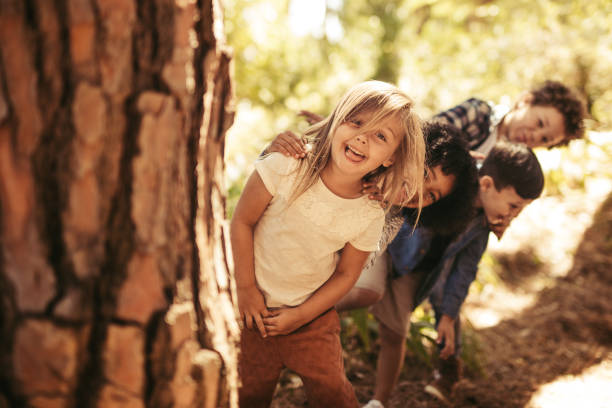 Kids playing hide and seek in a park