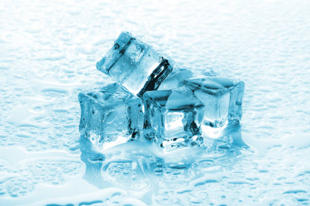 istock A pile of six ice cubes on a wet background 1164346113