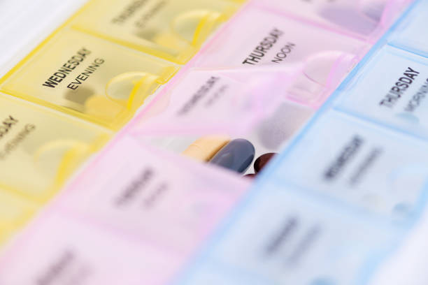 istock Daily pill reminder box on white background. 1164349293