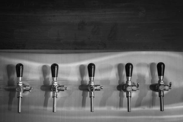 istock Beer tap in row - Black and white 1164350509