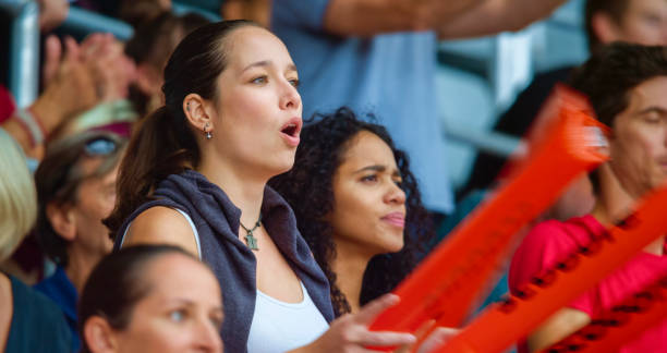 istock Woman watching match in stadium 1164352072