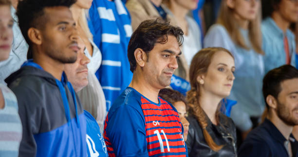istock Spectators during national anthem in stadium 1164352084