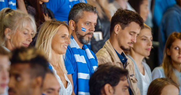 istock Spectators during national anthem in stadium 1164352093