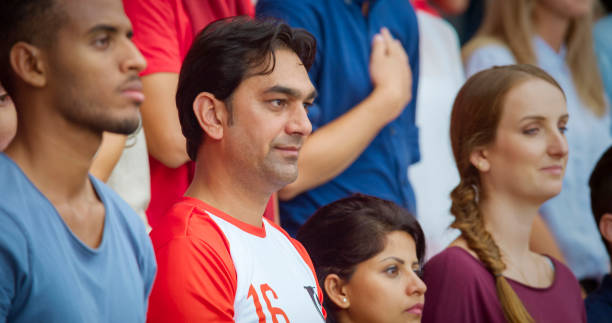 istock Spectators during national anthem in stadium 1164352168