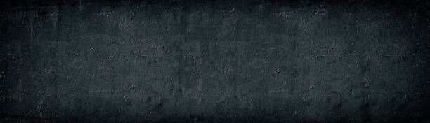 schwarze alte betonwand breite textur. raue zementoberfläche langes panorama. dunkelgrau düstere grunge panorama hintergrund - block paint design old fashioned stock-fotos und bilder