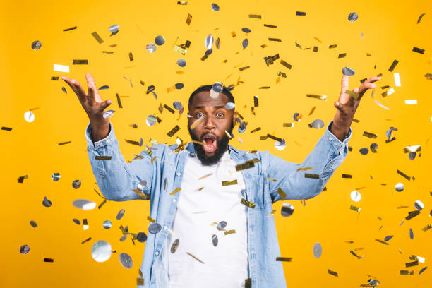 istock Winner! Cheerful african american young man dancing over yellow background. 1164355533