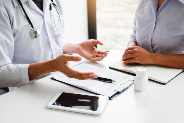 istock Doctors and patients Consulting about Treatment guidelines at office 1164357234