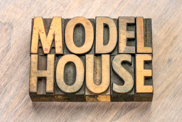 istock model house words in wood type 1164358565