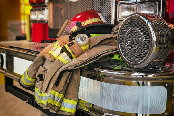 istock Firefighter protection gear on the fire truck bumper 1164358587