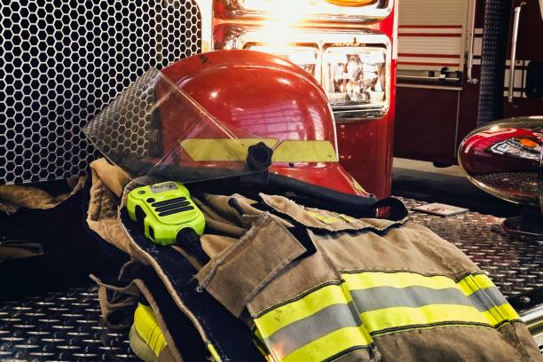 istock Firefighter protection gear on the fire truck bumper 1164358588