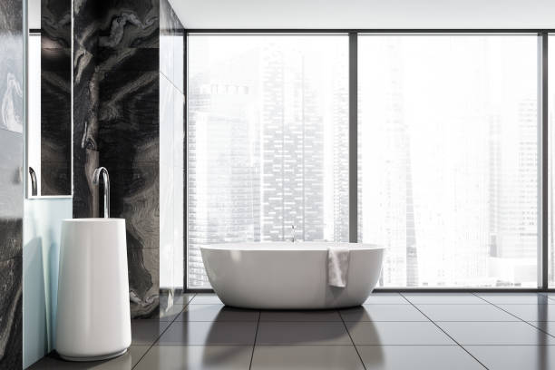 istock Panoramic black marble bathroom, sink and tub 1164358721