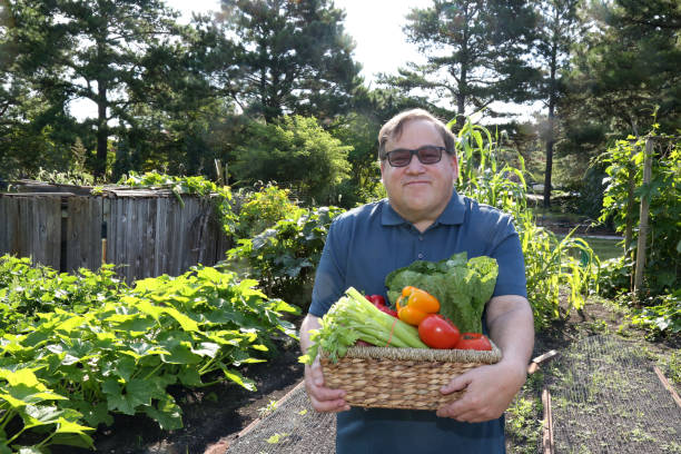 Disabled man works in the garden stock photo