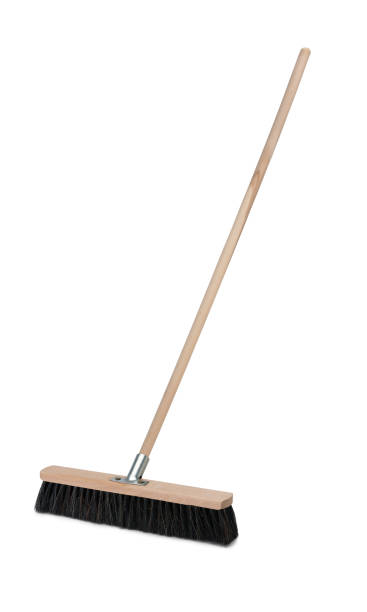 Broom with long handle isolated on white background Broom with long wooden handle isolated on white background. Cleaning equipment for housework broom photos stock pictures, royalty-free photos & images