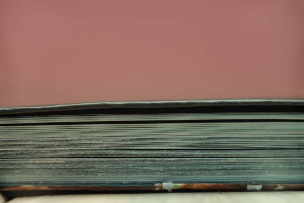 istock Close up beautiful book on a wooden table background. 1164360582