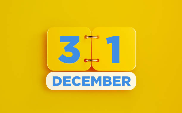 Yellow December 31 Calendar on Yellow Background Yellow calendar on yellow background. December 31 writes on the calendar. Horizontal composition with copy space. Top view. december 31 stock pictures, royalty-free photos & images