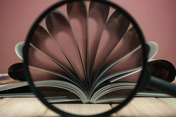 istock Close up beautiful book on a wooden table background. 1164361475
