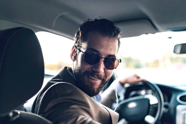 istock Businessman Driving Car 1164361492