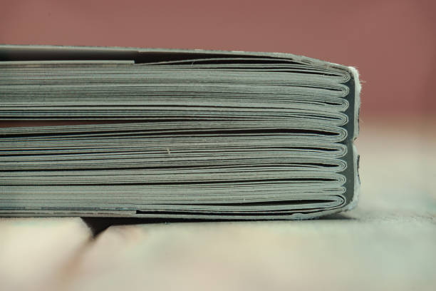 istock Close up beautiful book on a wooden table background. 1164361813