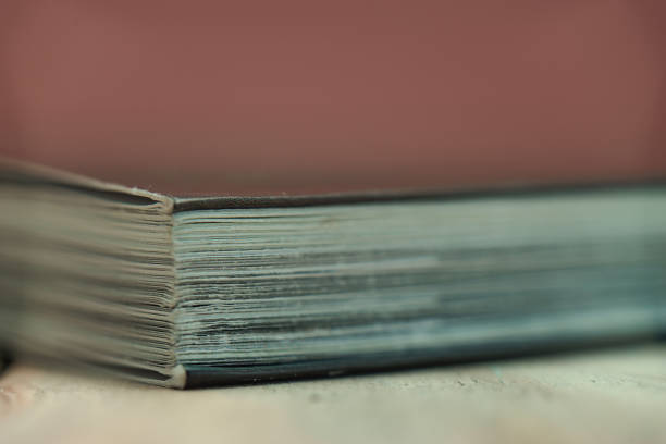 istock Close up beautiful book on a wooden table background. 1164361856