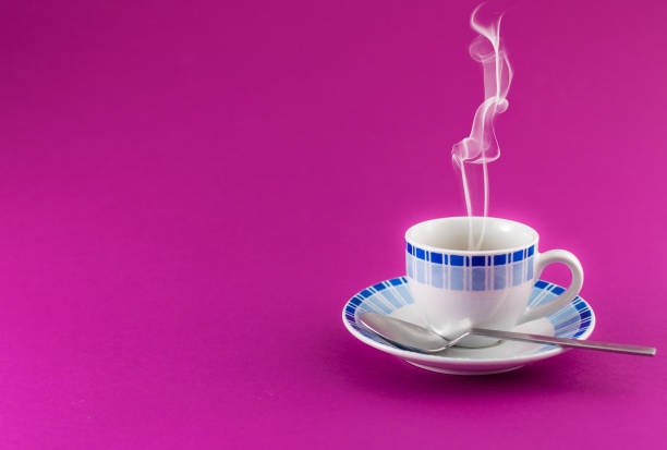 istock Small cup of coffee on colored background 1164361875