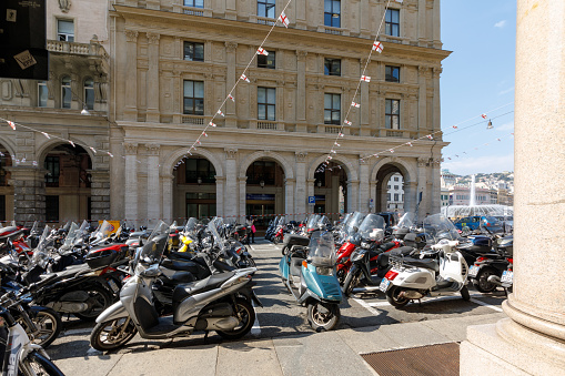Genoa, Italy - Apr 17, 2019: Scooter parking on Via Francesco Petrarca near Piazza Raffaele De Ferrari