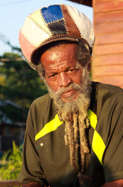 Negril, Jamaica - May 24. 2010: Portrait of rasta man with beard, dredlocks and rastacap