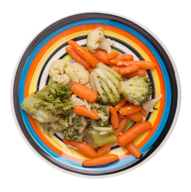 istock provencal vegetables on a plate.grilled vegetables on a plate isolated on white background.broccoli and carrots on a plate top view.healthy  food 1164365058