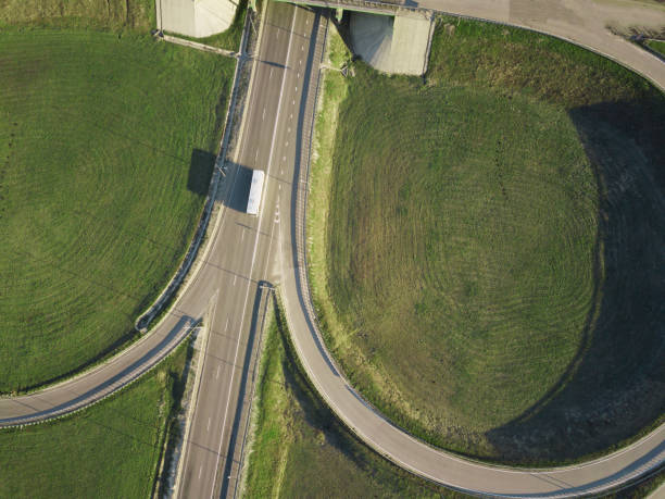 istock Road Junction highway intersection summer morning with car. Aerial Top View 1164365829