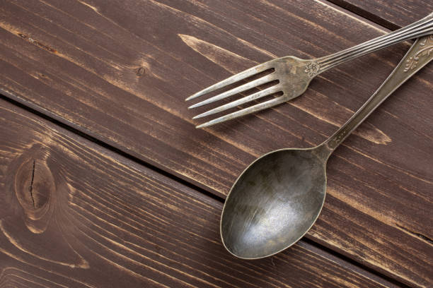 istock Raw macaroni pasta on brown wood 1164366112