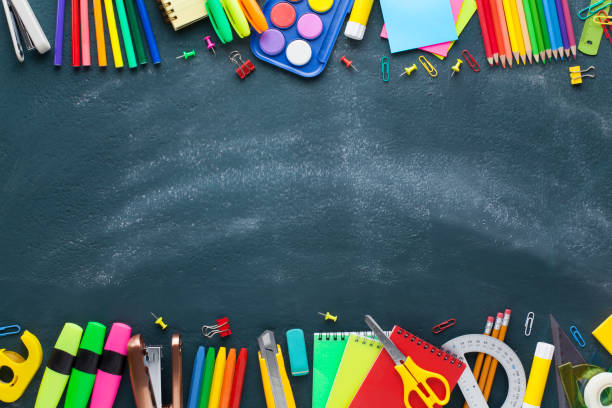 istock School and office supplies on blackboard. Back to school concept. 1164369144