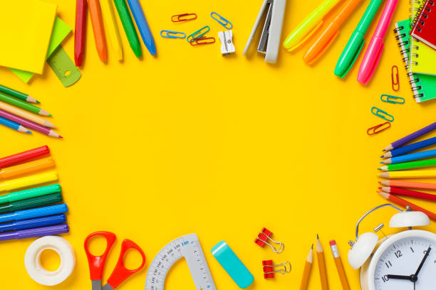 istock School supplies on yellow background. Back to school concept. 1164369415