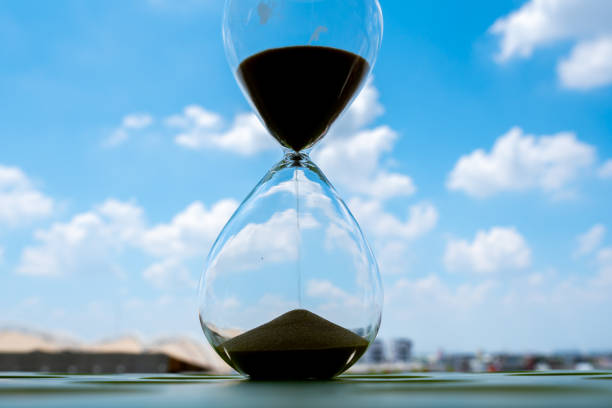 istock Sand clock with sky and cloud business concept 1164370733