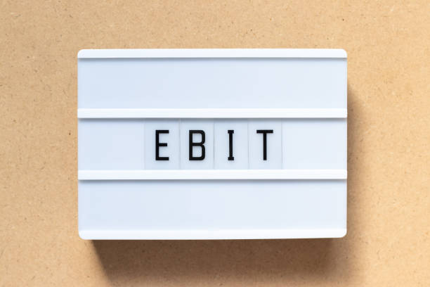 istock White lightbox with word EBIT (Abbreviation of Earnings Before Interest and Taxes) on wood background 1164371210