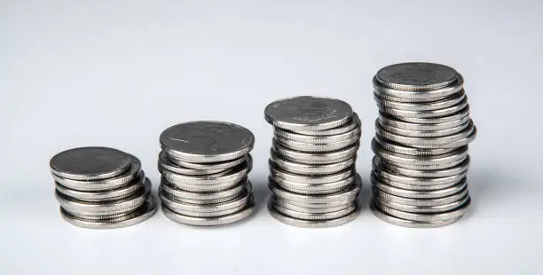 Photo of four stacks of Russian ruble coins close up