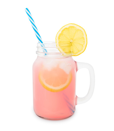 Pink Lemonade in a jar with lemon slice isolated on white