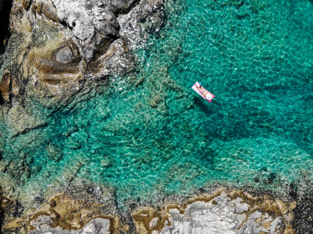 istock Drone image of woman on seabed. 1164373719
