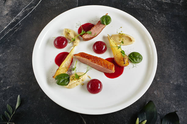 istock Creative Molecular Dish of Duck Breast, Baked Pear and Cherry Spheres 1164375810
