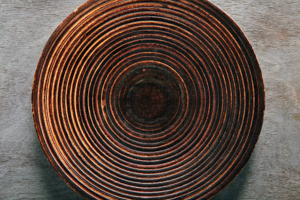 istock Wood Round Plate on Gray Wooden Background 1164375896