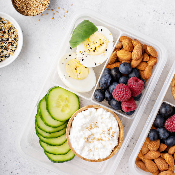 Lunch or snack box with high protein food Lunch or snack box with high protein food, cottage cheese, nuts and eggs dietary fiber photos stock pictures, royalty-free photos & images